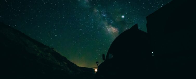 Silhouette of a truck under the stars