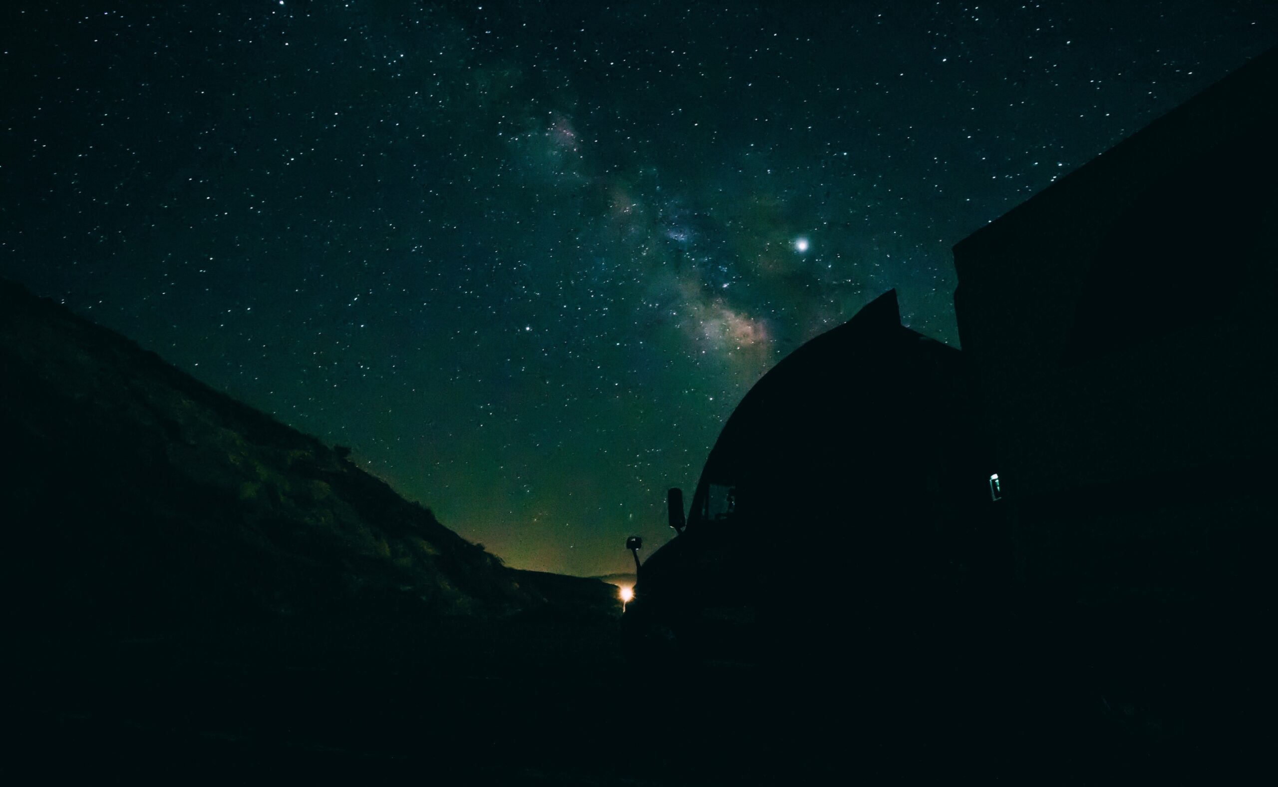 Silhouette of a truck under the stars