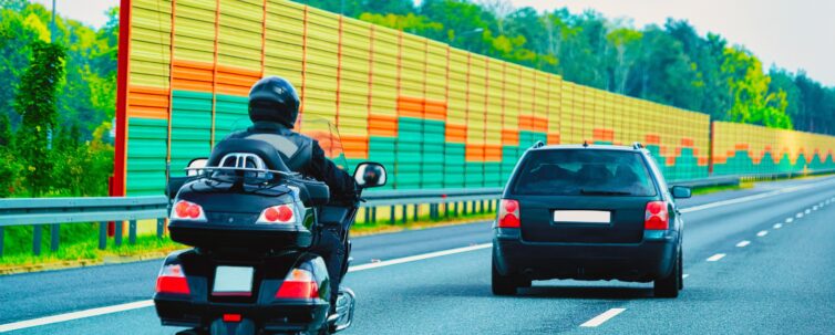 Motorcycle and car on the road