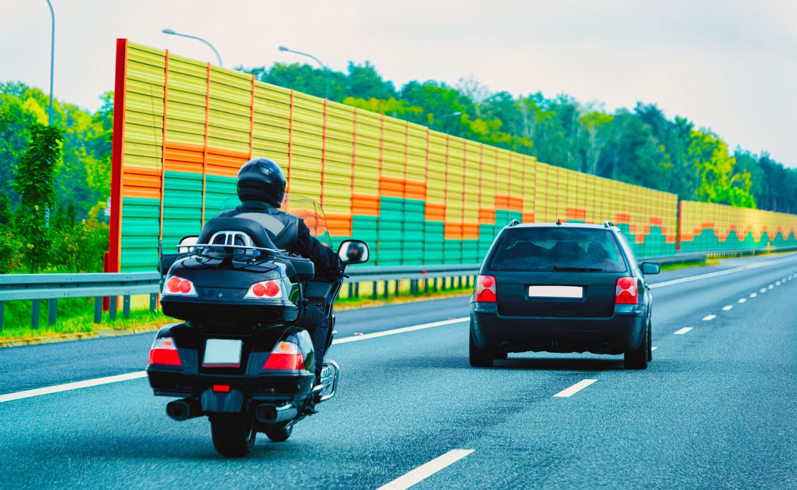 Motorcycle and car on the road