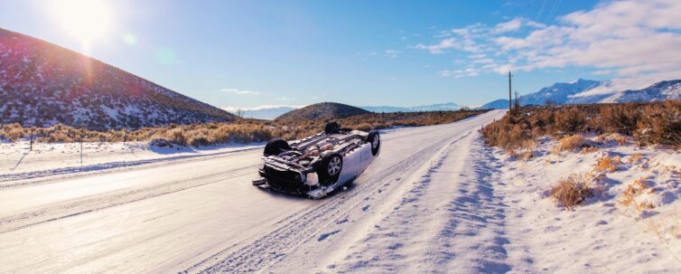 car rollover on a deserted snowy road