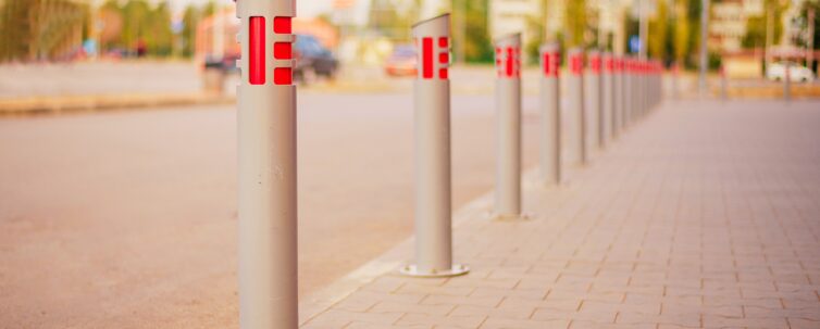Metal fence on the street for the safety of the pedestrians from cars