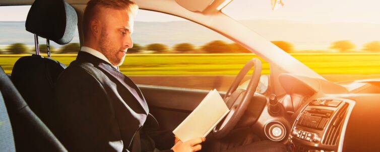 Businessman Sitting Inside Self Driving Car