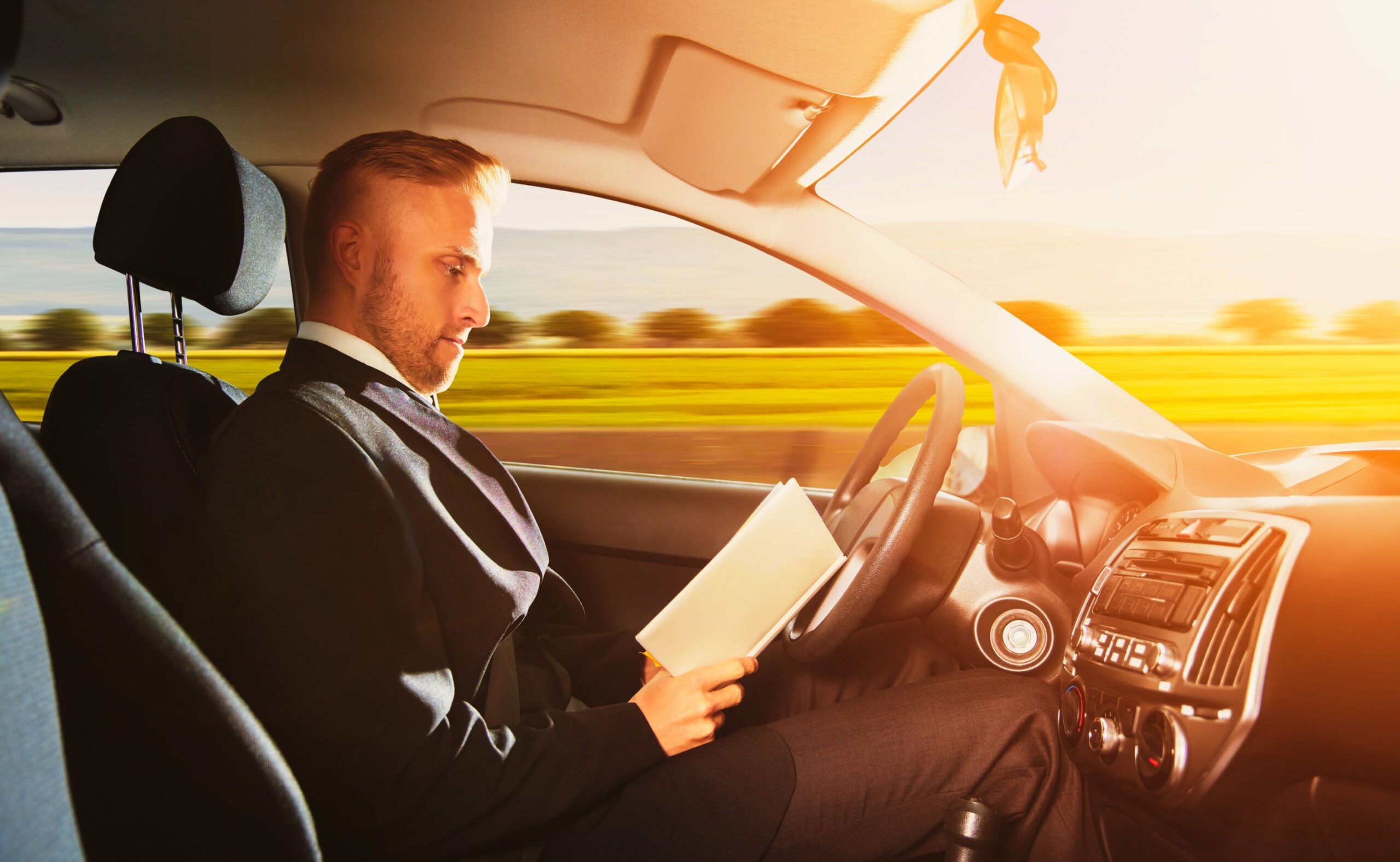 Businessman Sitting Inside Self Driving Car
