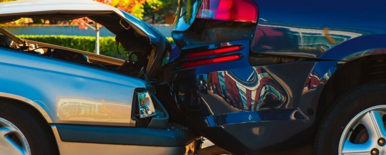 Auto accident involving two cars on a city street