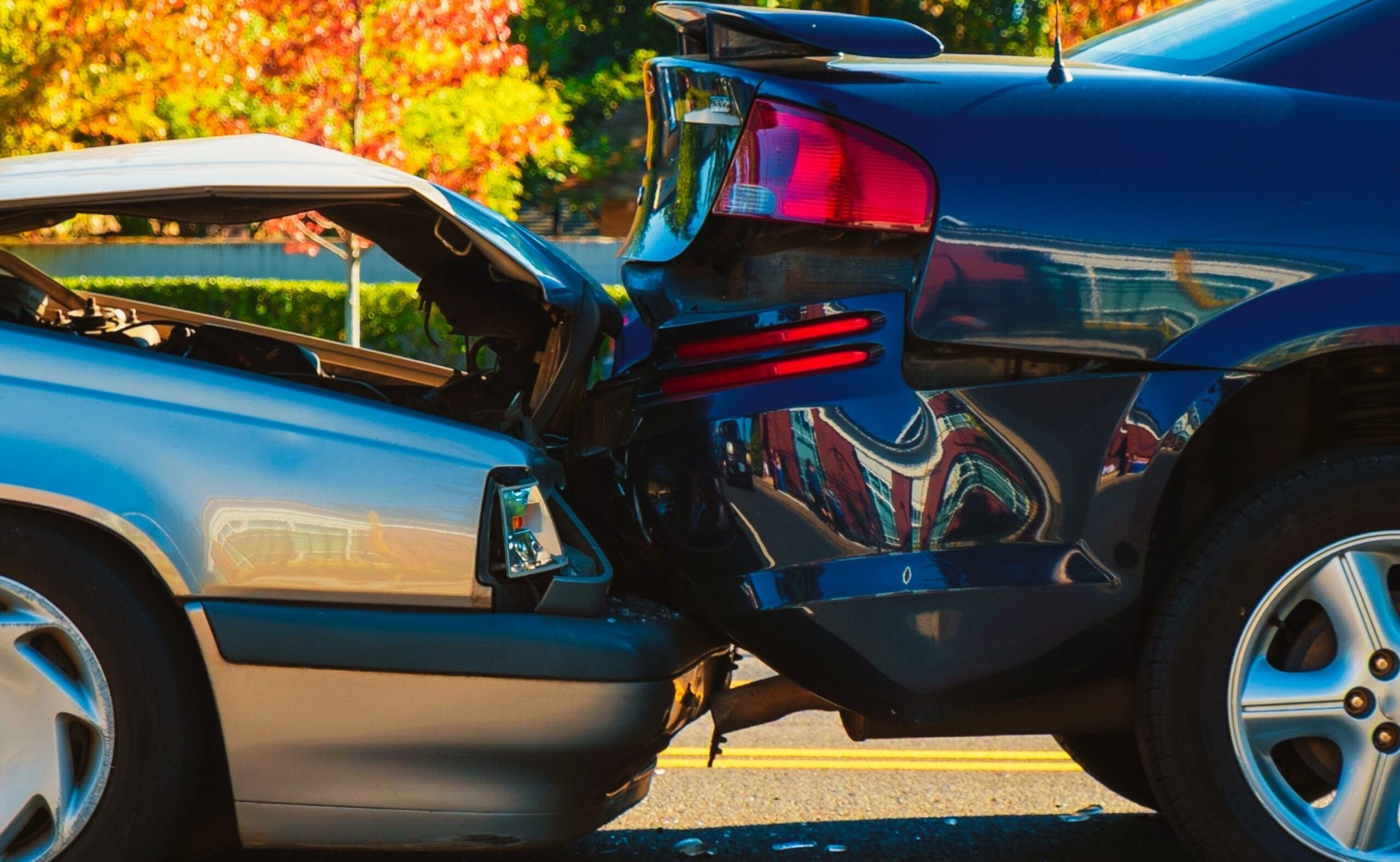 Auto accident involving two cars on a city street