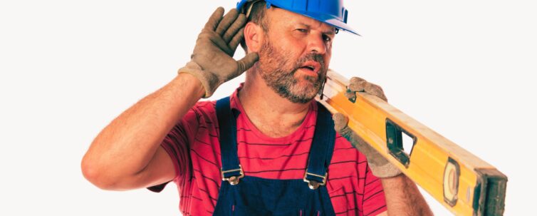 a worker holding hand to ear