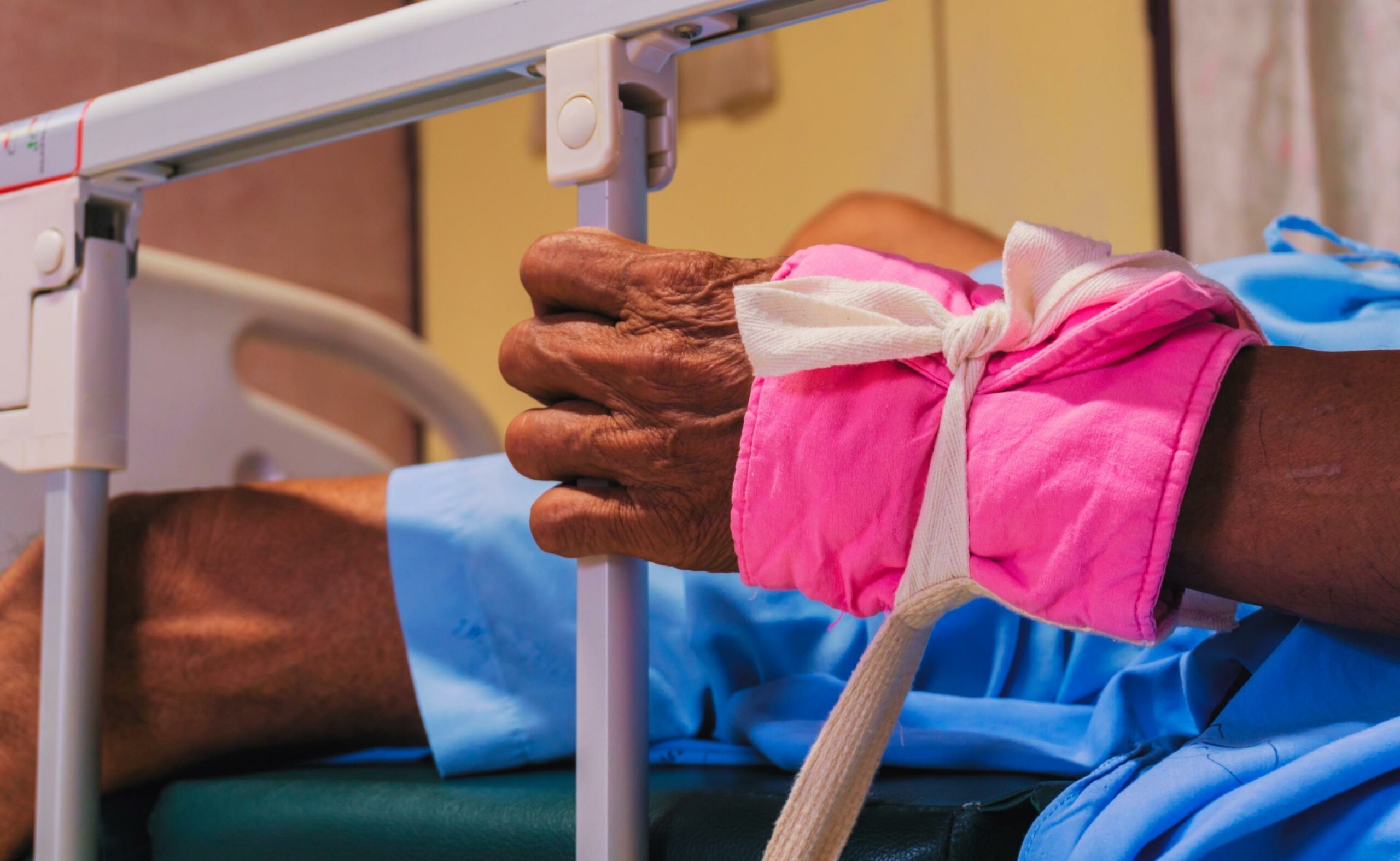 Crazy patient restrained on hospital bed
