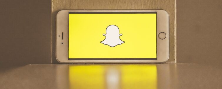 Snapchat logo in screen of a smartphone