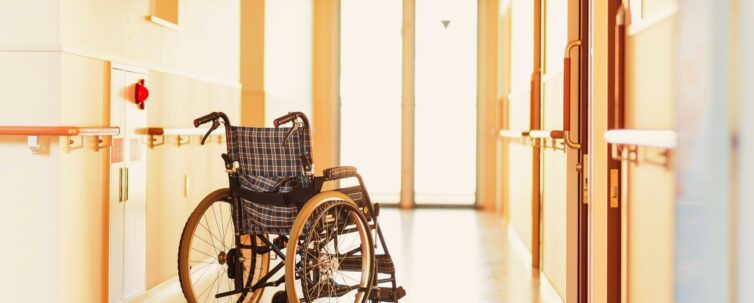 Wheelchair on hallway of nursing home