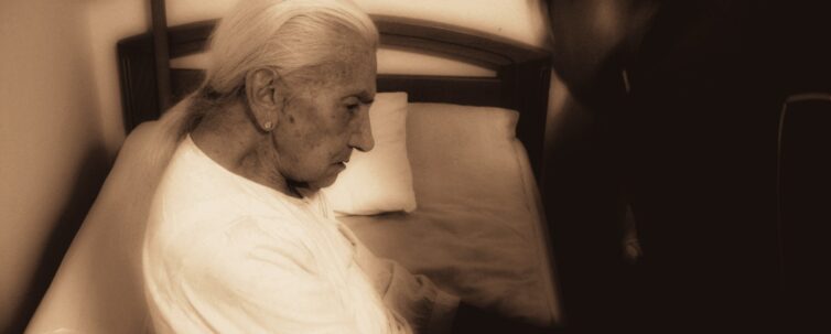 Woman with Dementia with a caregiver