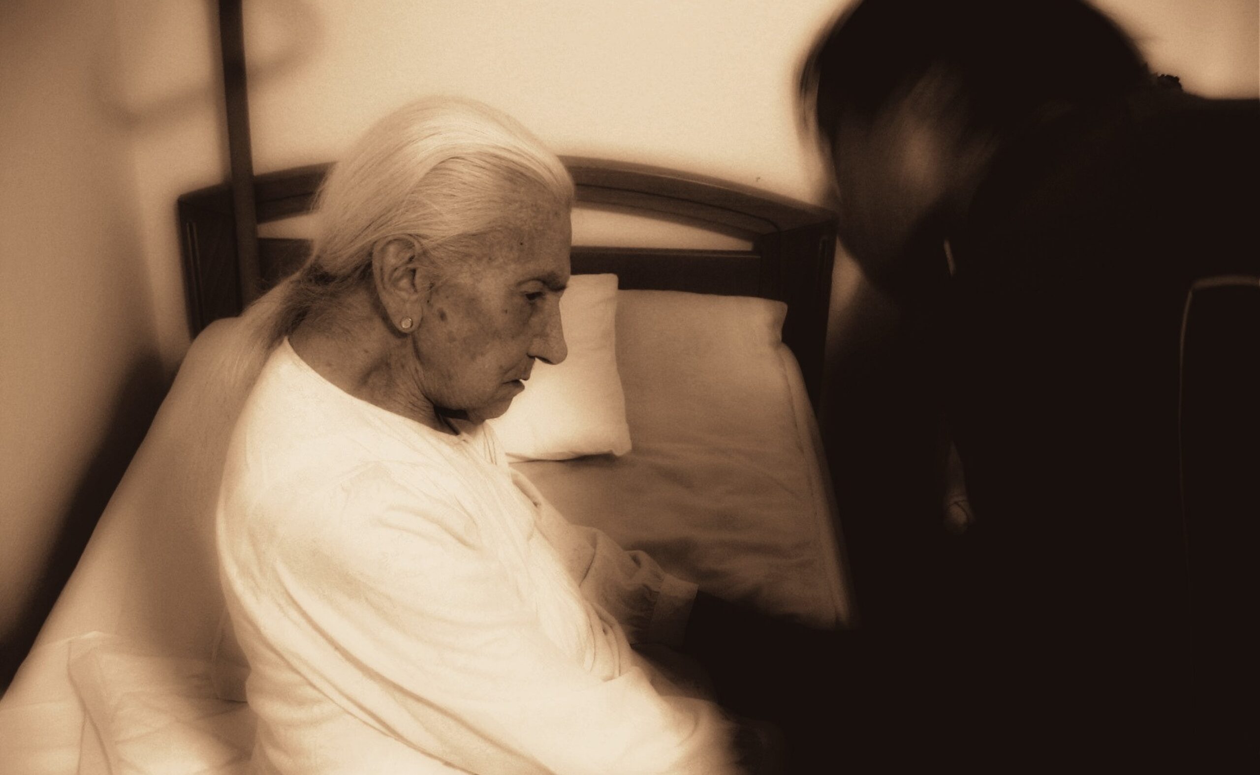 Woman with Dementia with a caregiver