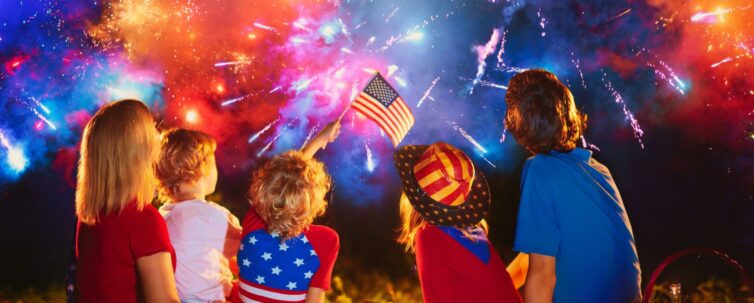 American family celebrating independence day with fireworks on 4th of July