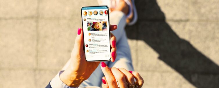 Woman using social media microblogging app on her phone