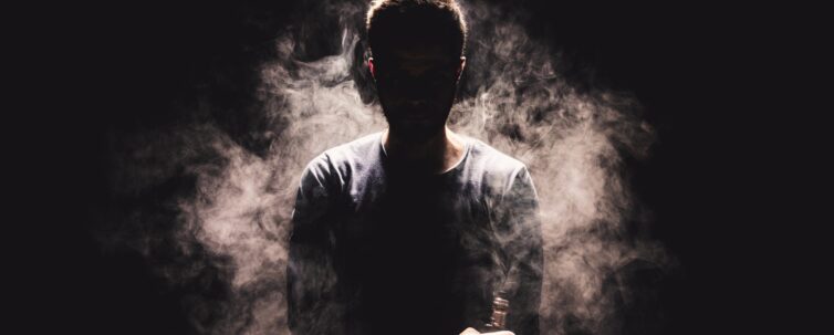 vaping flavored e-liquid from an electronic cigarette