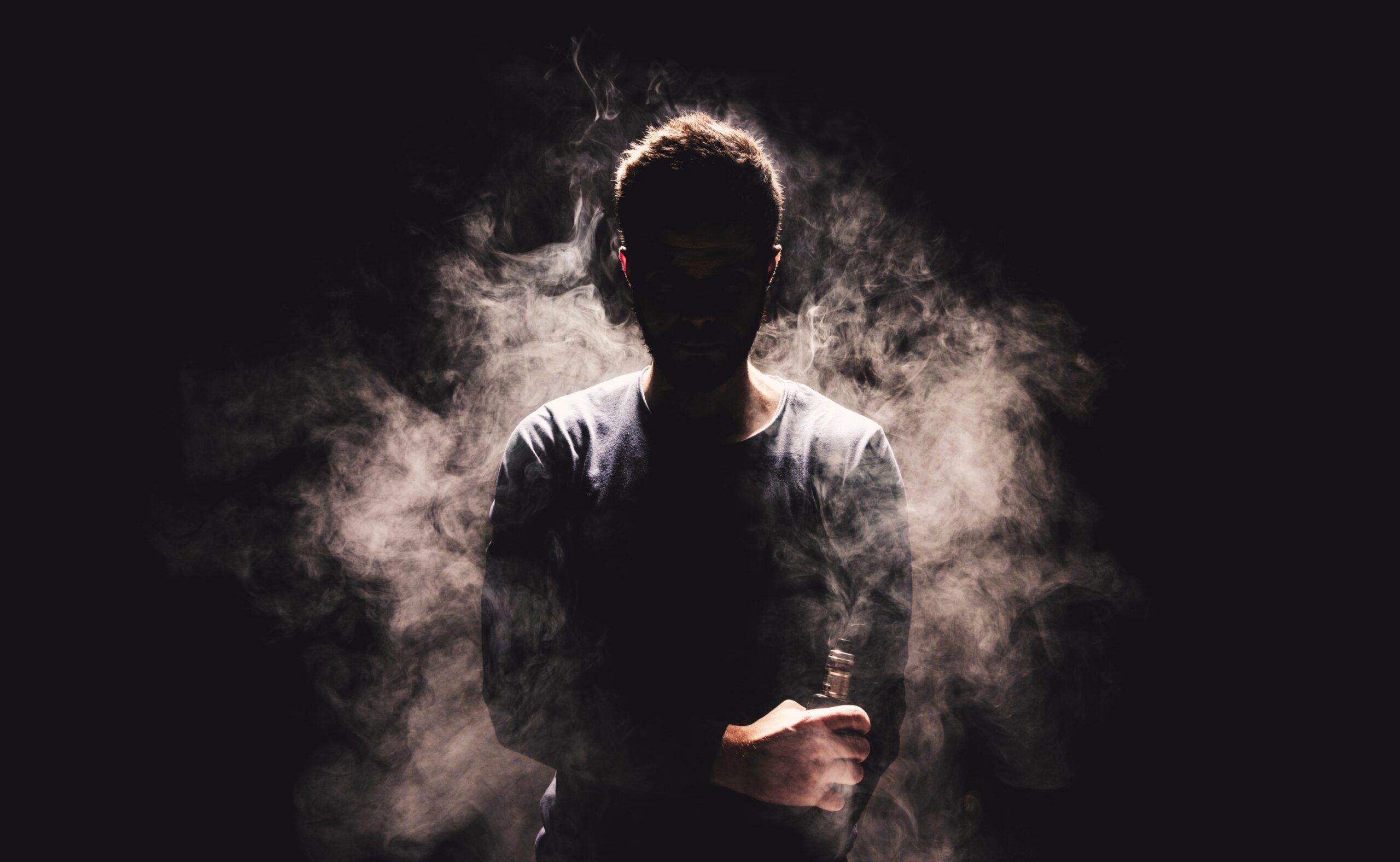 vaping flavored e-liquid from an electronic cigarette