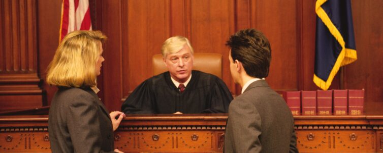 Judge and lawyers in courtroom for deposition