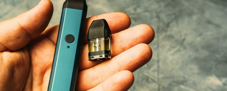 Vape pod in male hand or pod mod with changeable cartridge's