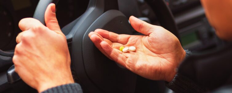 Man taking drugs inside a car