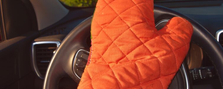 Hot steering wheel, driver wearing pot holder