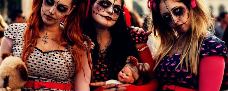 three women on Halloween costume ready for trick or treat