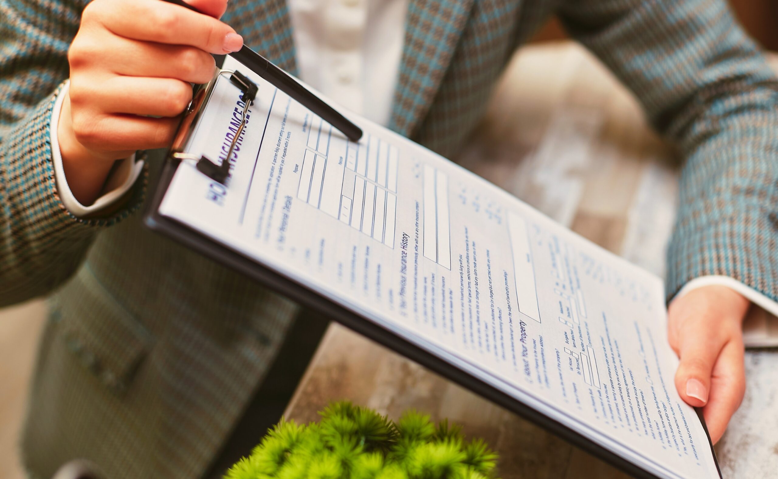 an insurance agent holding an insurance policy