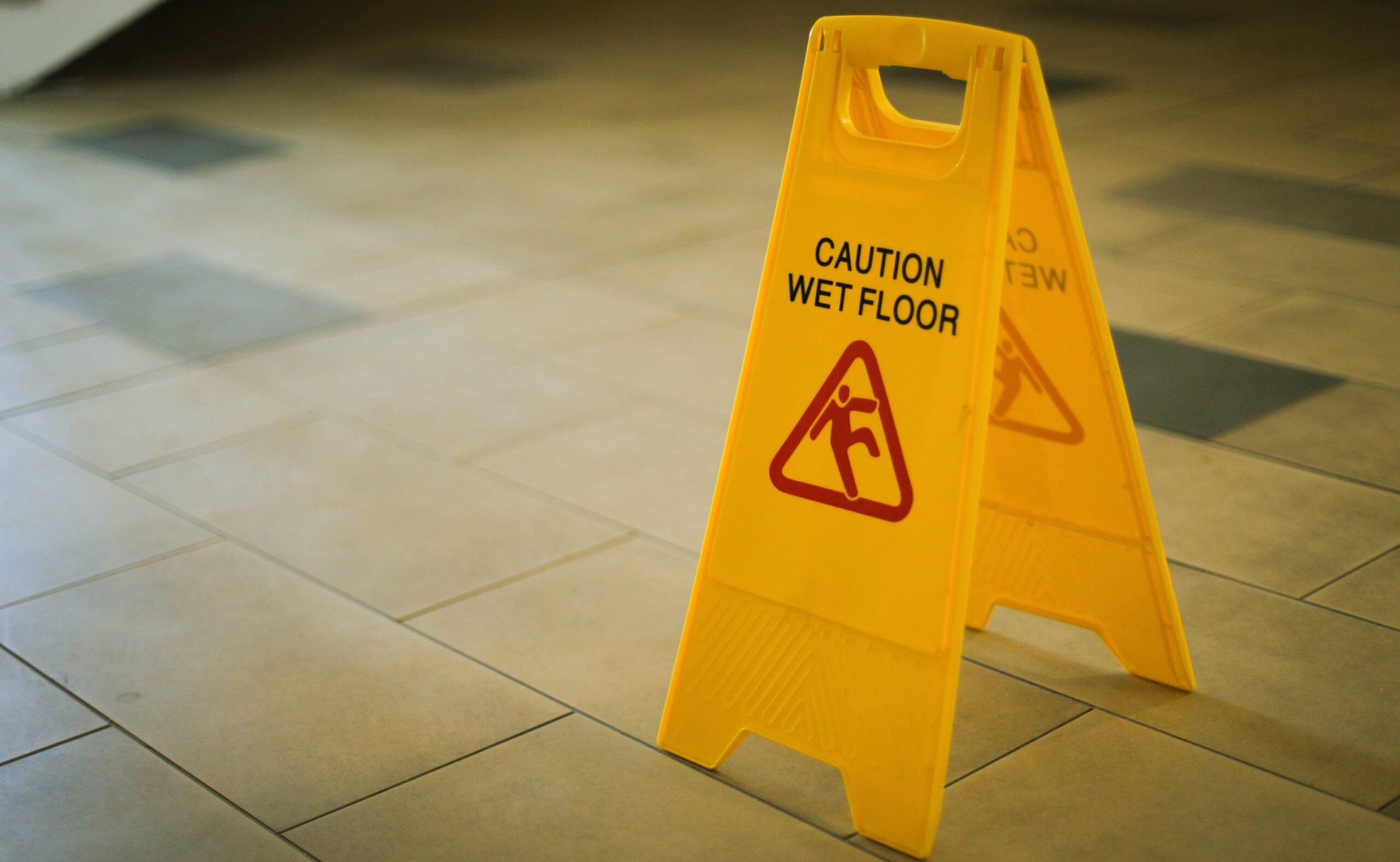 yellow wet floor sign