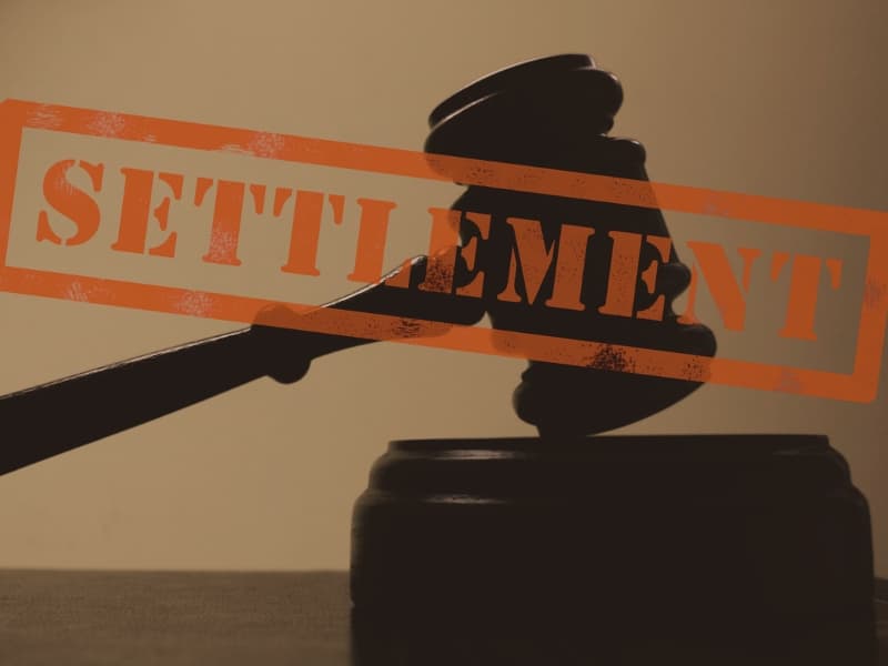 judge legal gavel with Settlement stamp