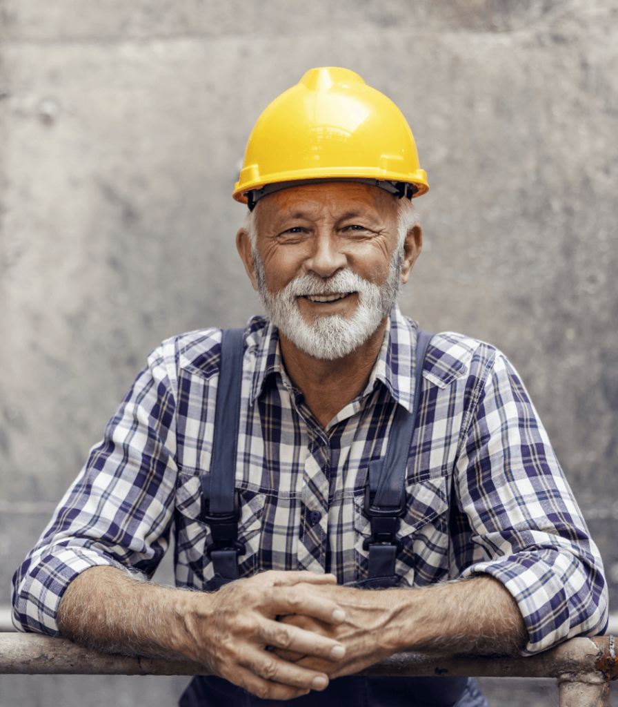 smiling bearded construction worker wearing hard hat