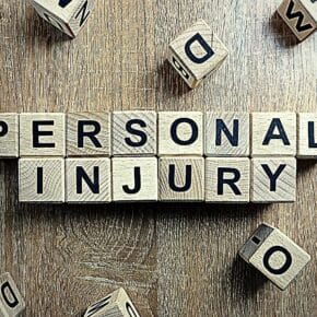 Personal injury text from wooden blocks on desk